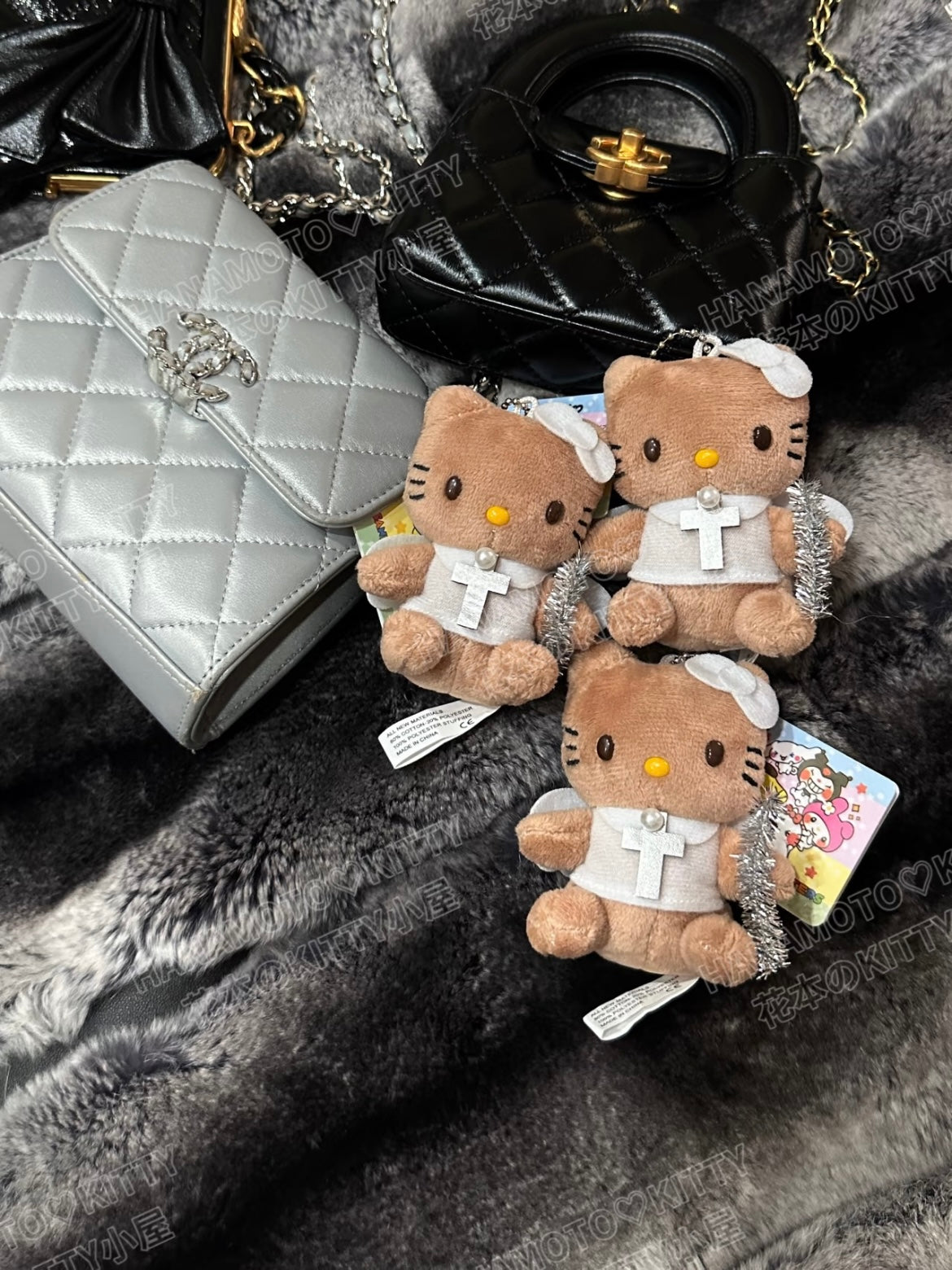 Angel tanned hello kitty pendant