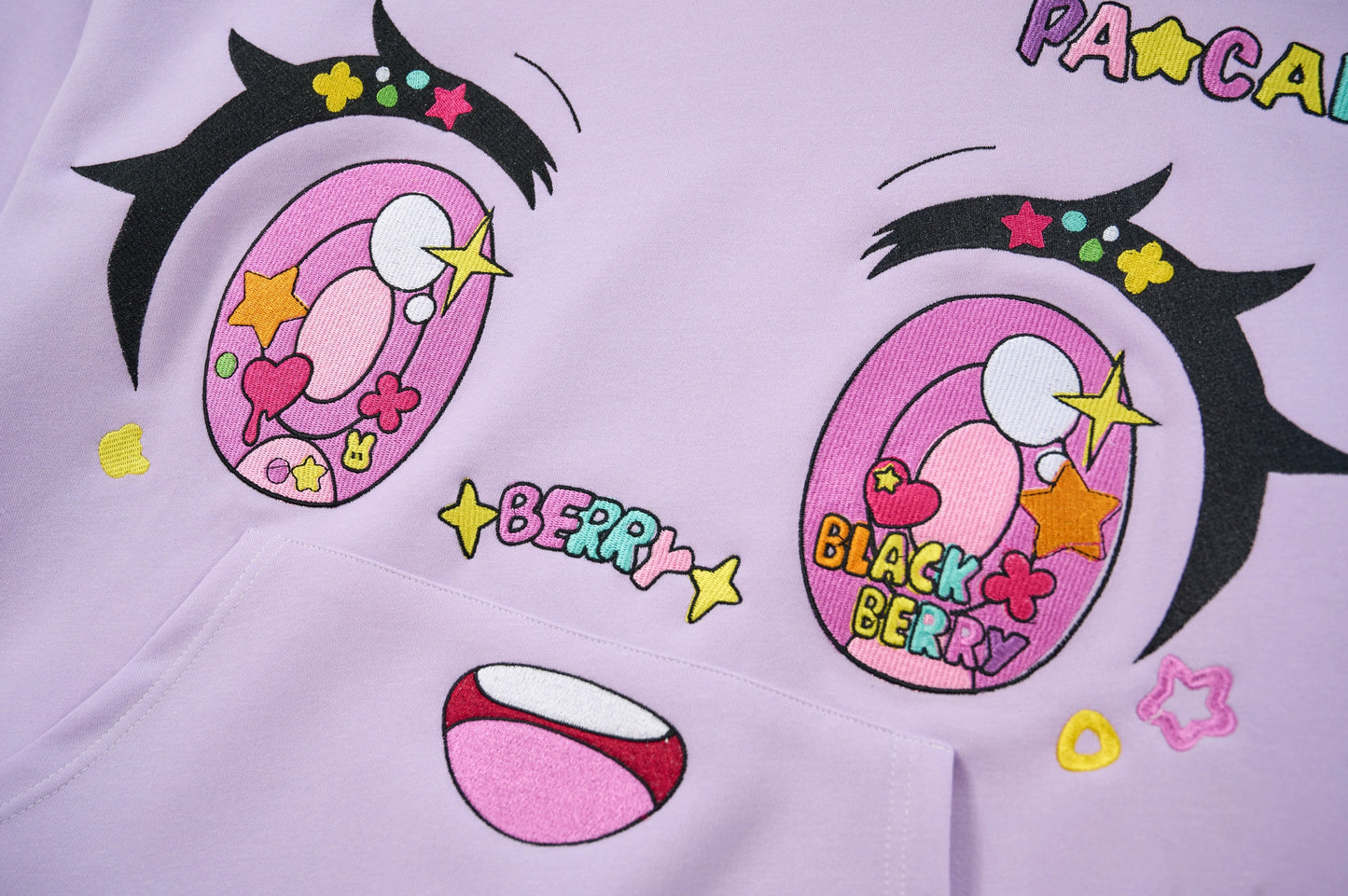 purple comic embroidery emoji sweater
