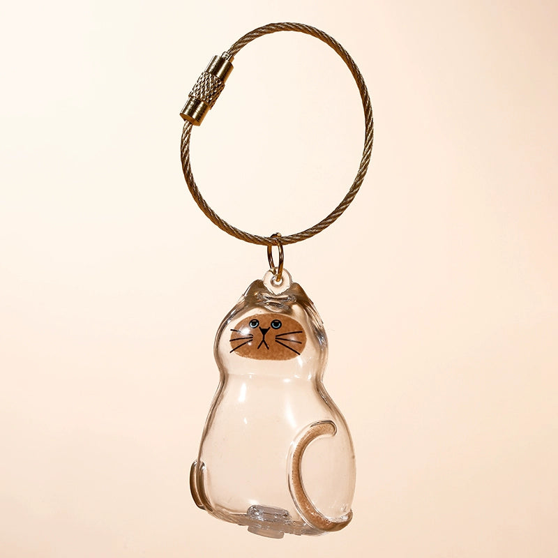 Transparent cat fur storage box with hanging decorations and twisted eggs