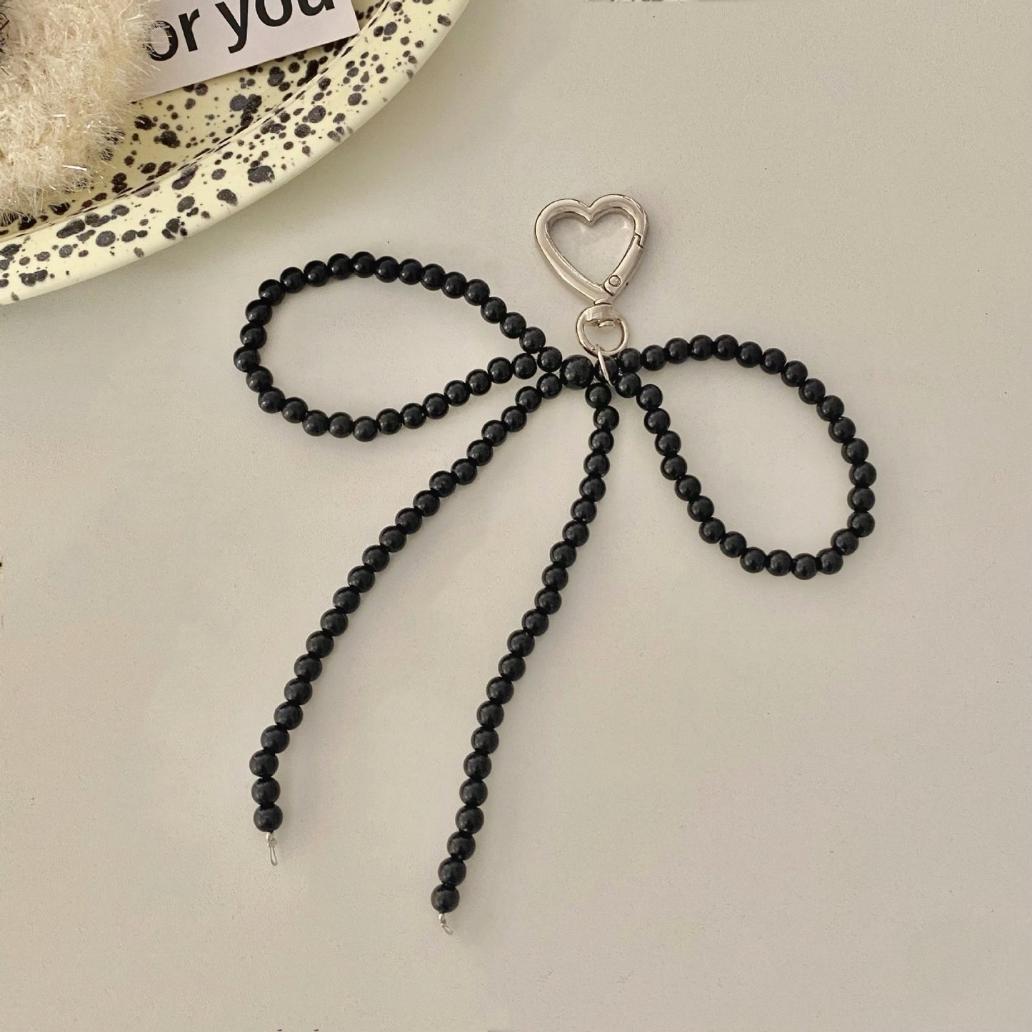 Beaded bow charm