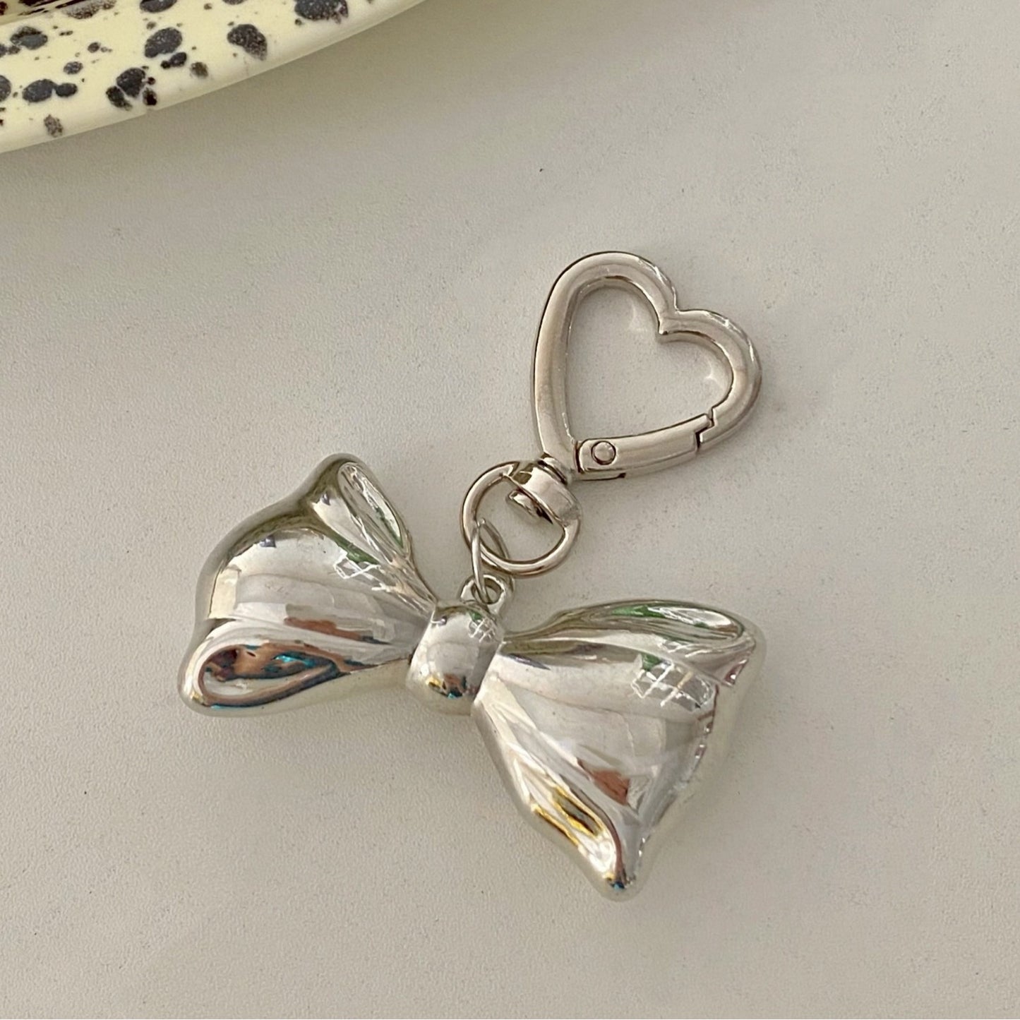 Beaded bow pendant