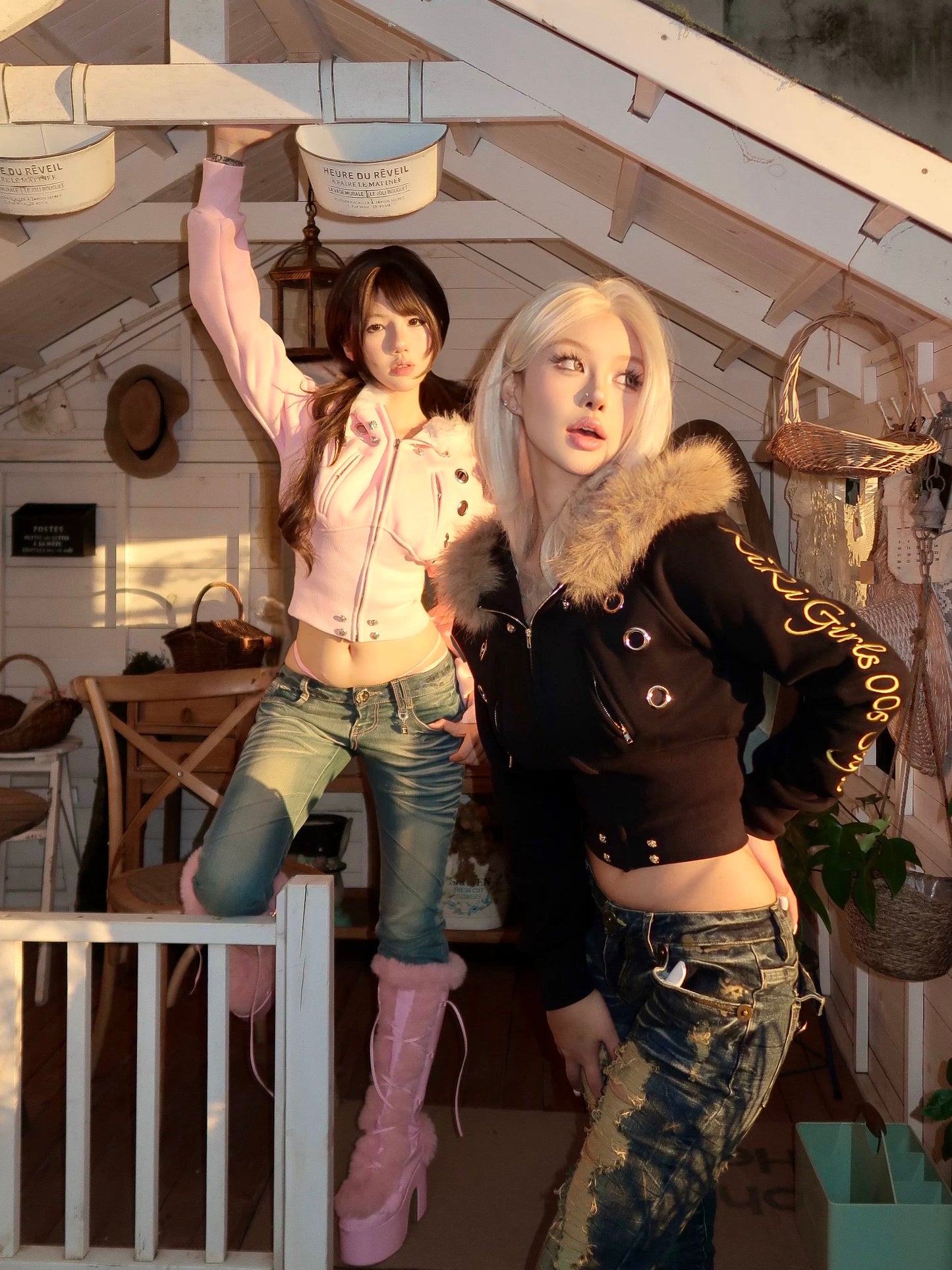 furry hooded sweatshirt and a black embroidered jacket