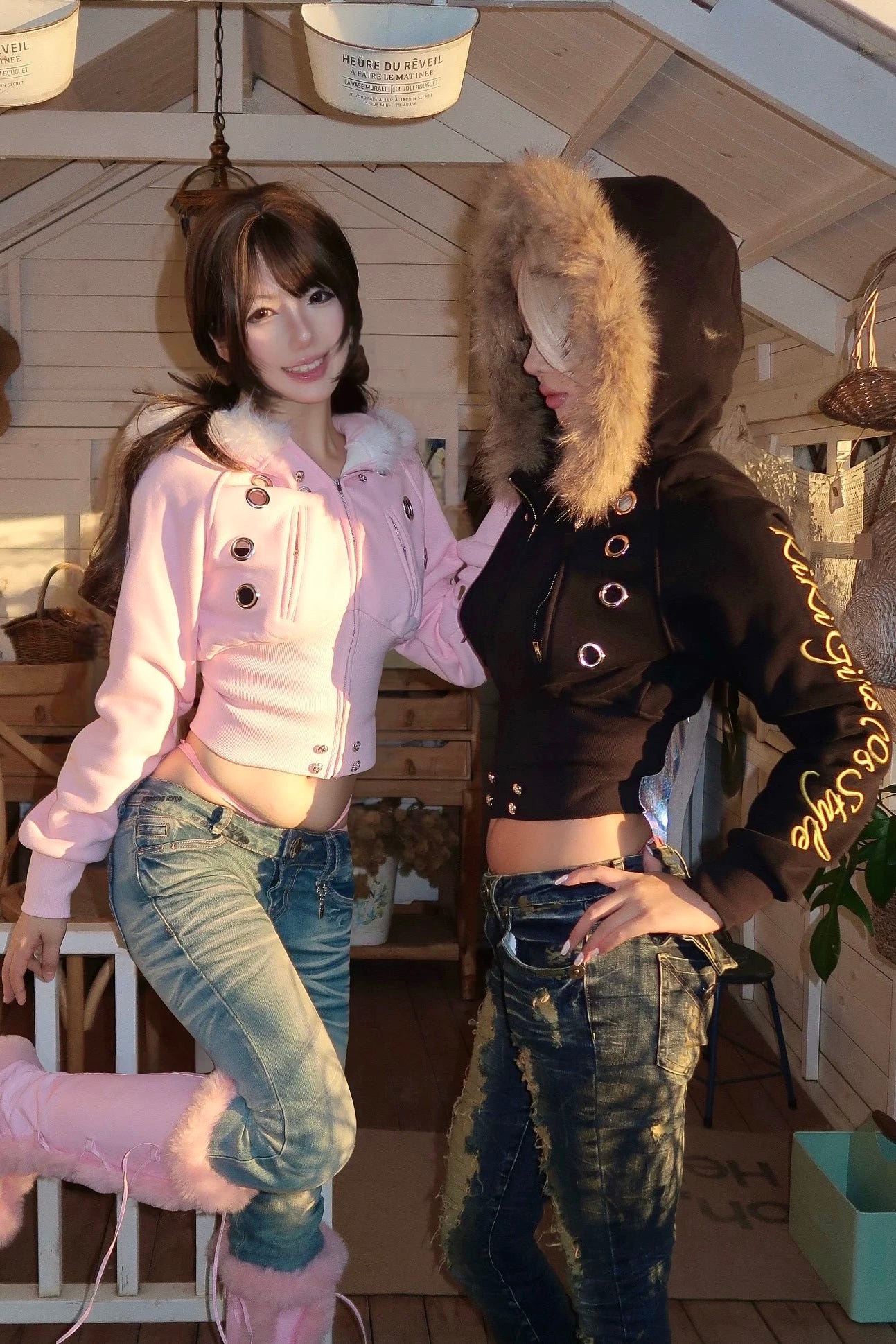 furry hooded sweatshirt and a black embroidered jacket