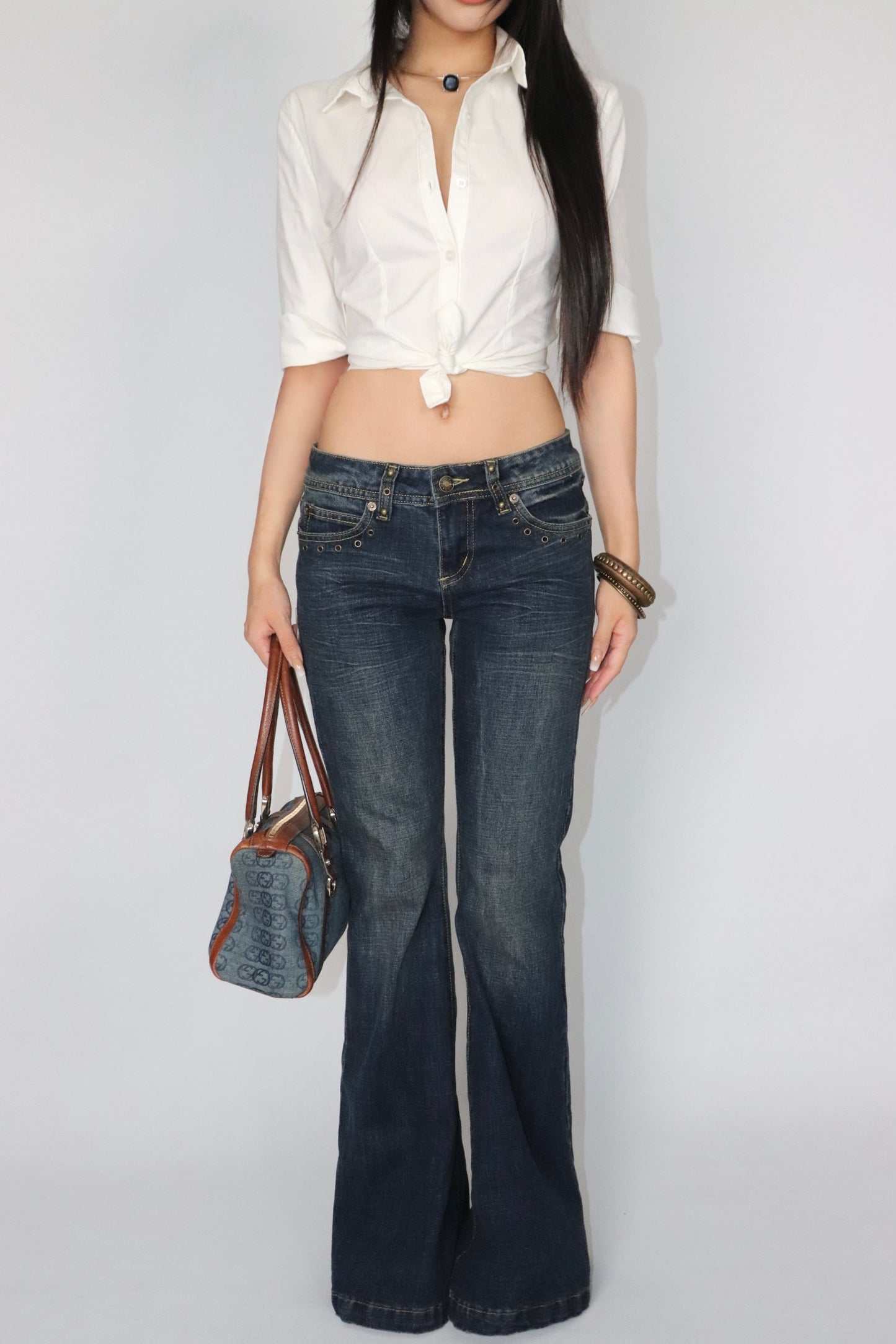 Rivet trimmed low-rise jeans