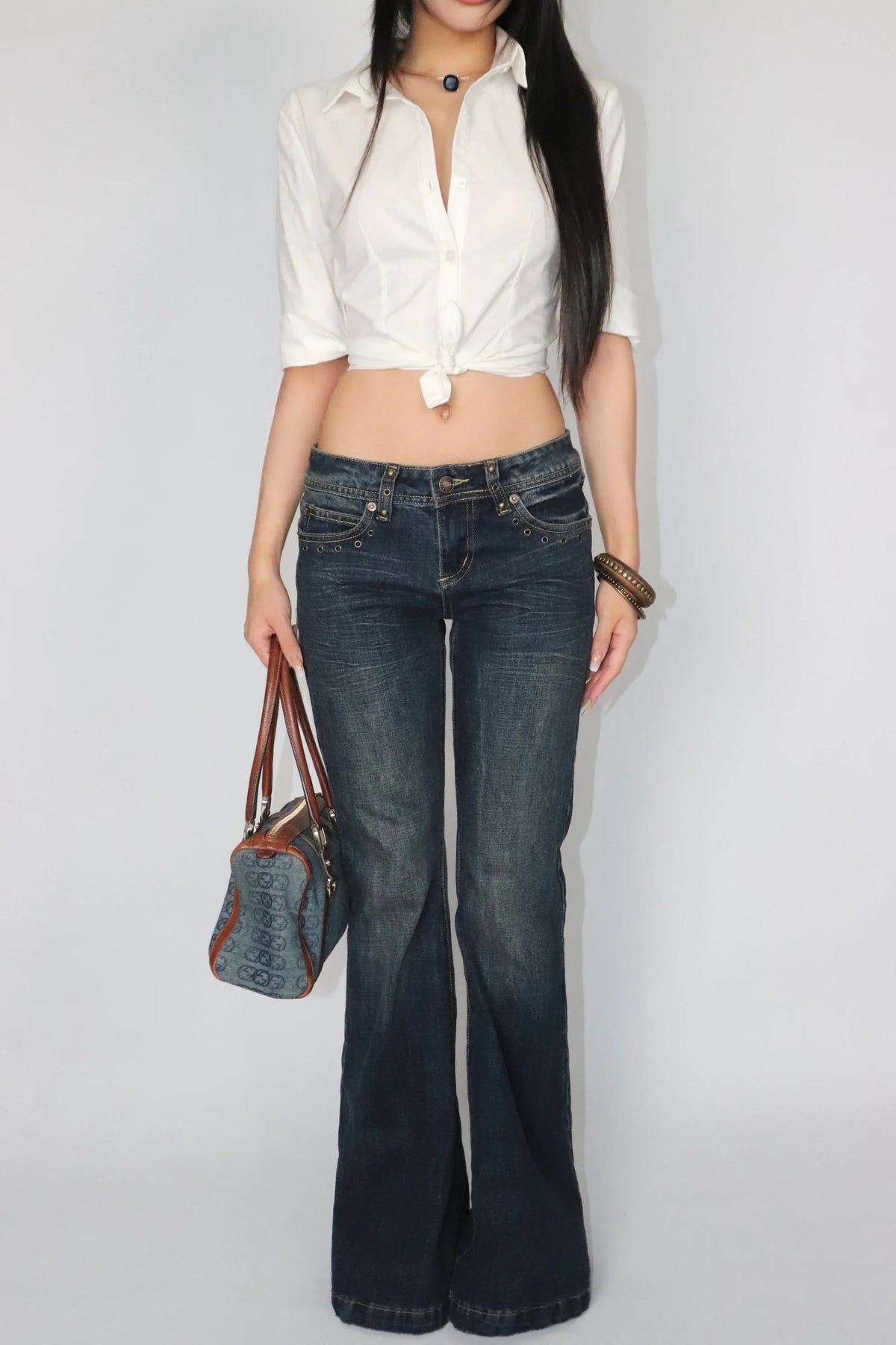 Rivet trimmed low-rise jeans