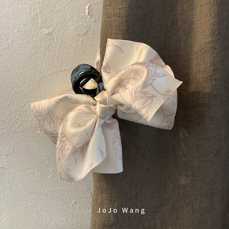 Satin bow hair catcher