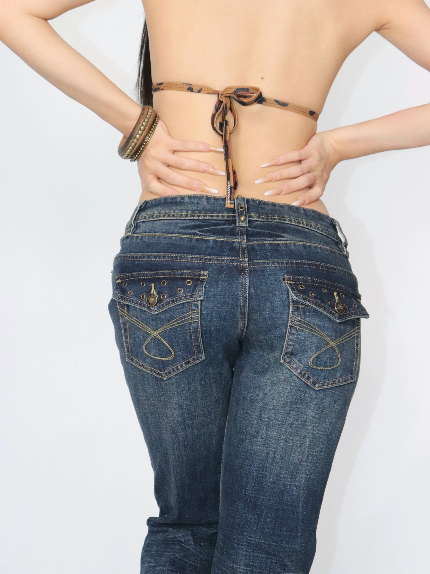 Rivet trimmed low-rise jeans