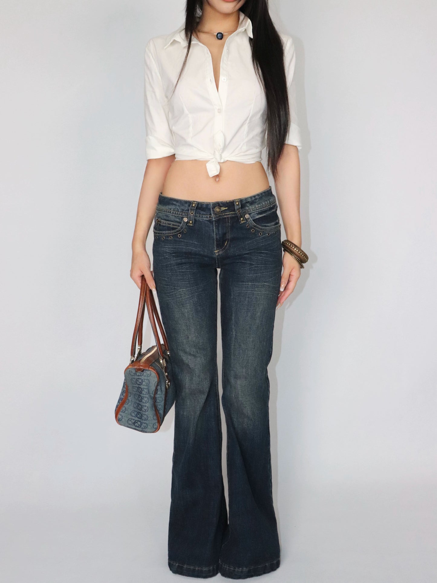 Rivet trimmed low-rise jeans
