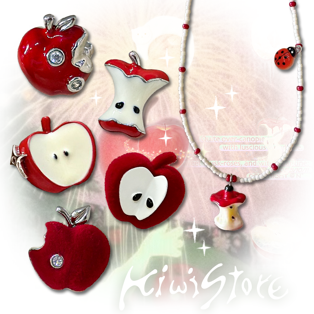 A necklace with apple earrings and ear clips