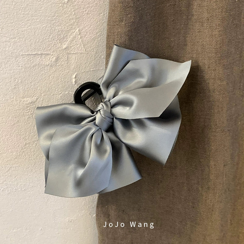 Satin bow hair catcher