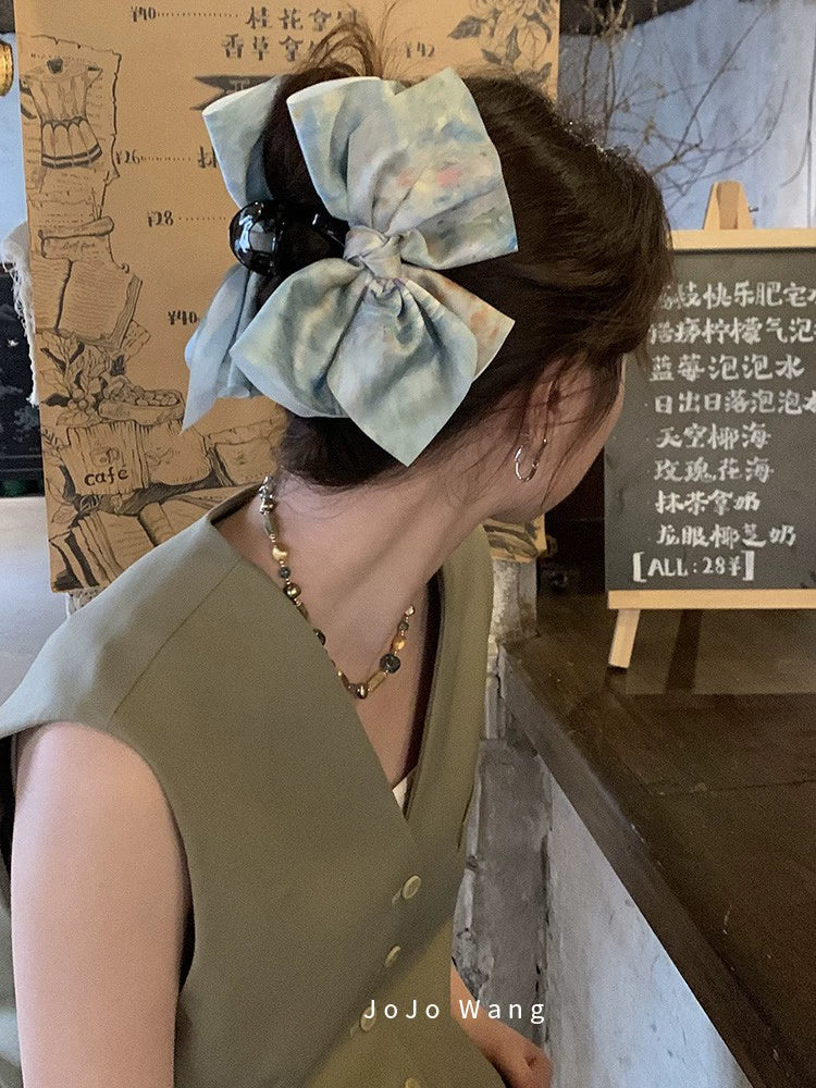 Satin bow hair catcher