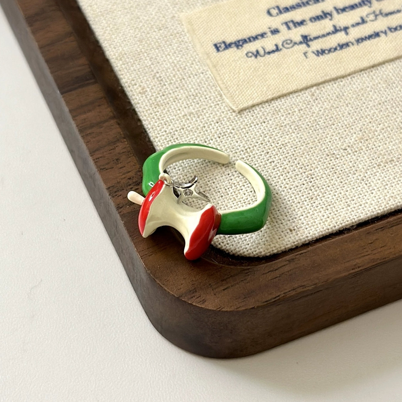 A necklace with apple earrings and ear clips