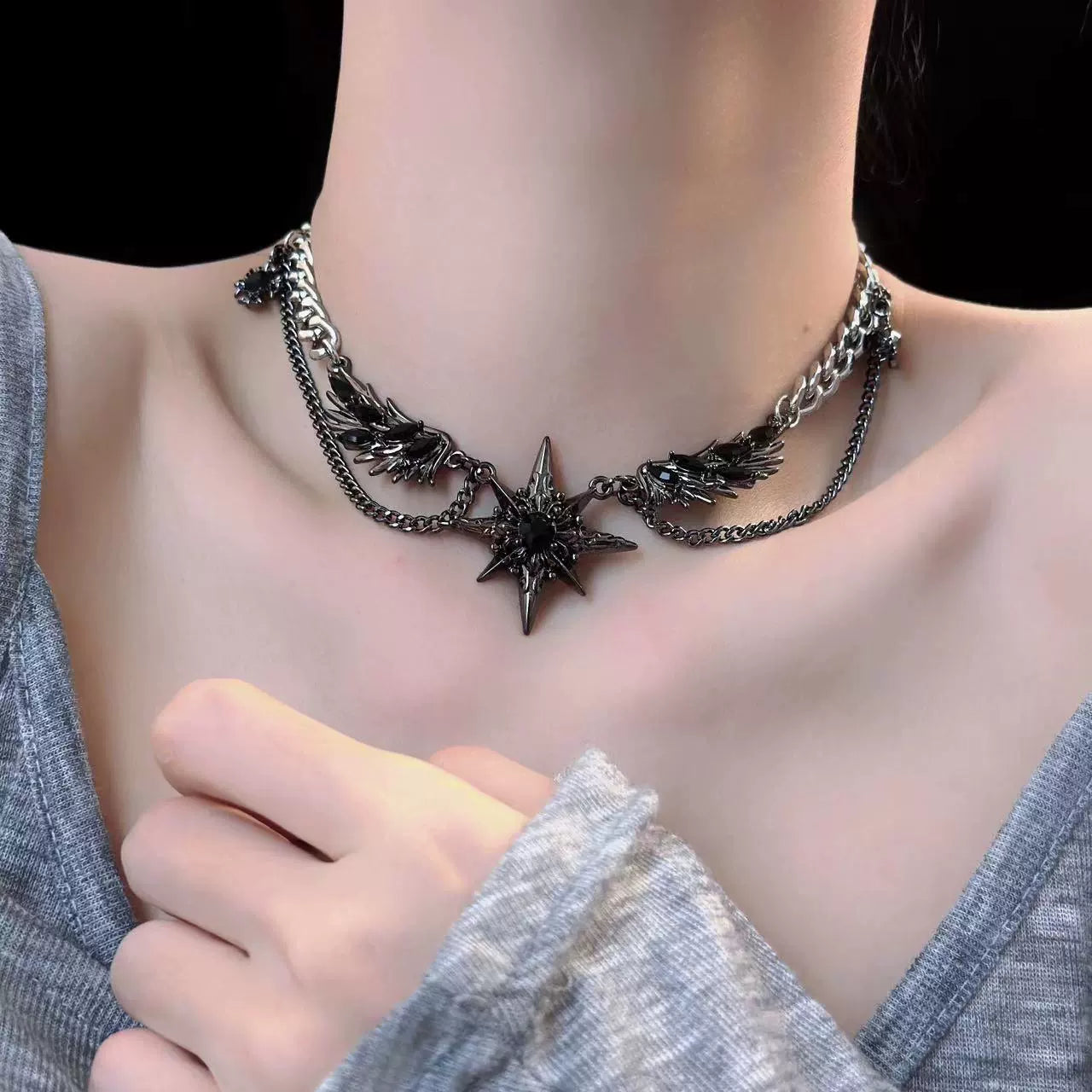 Black winged starry necklace earrings