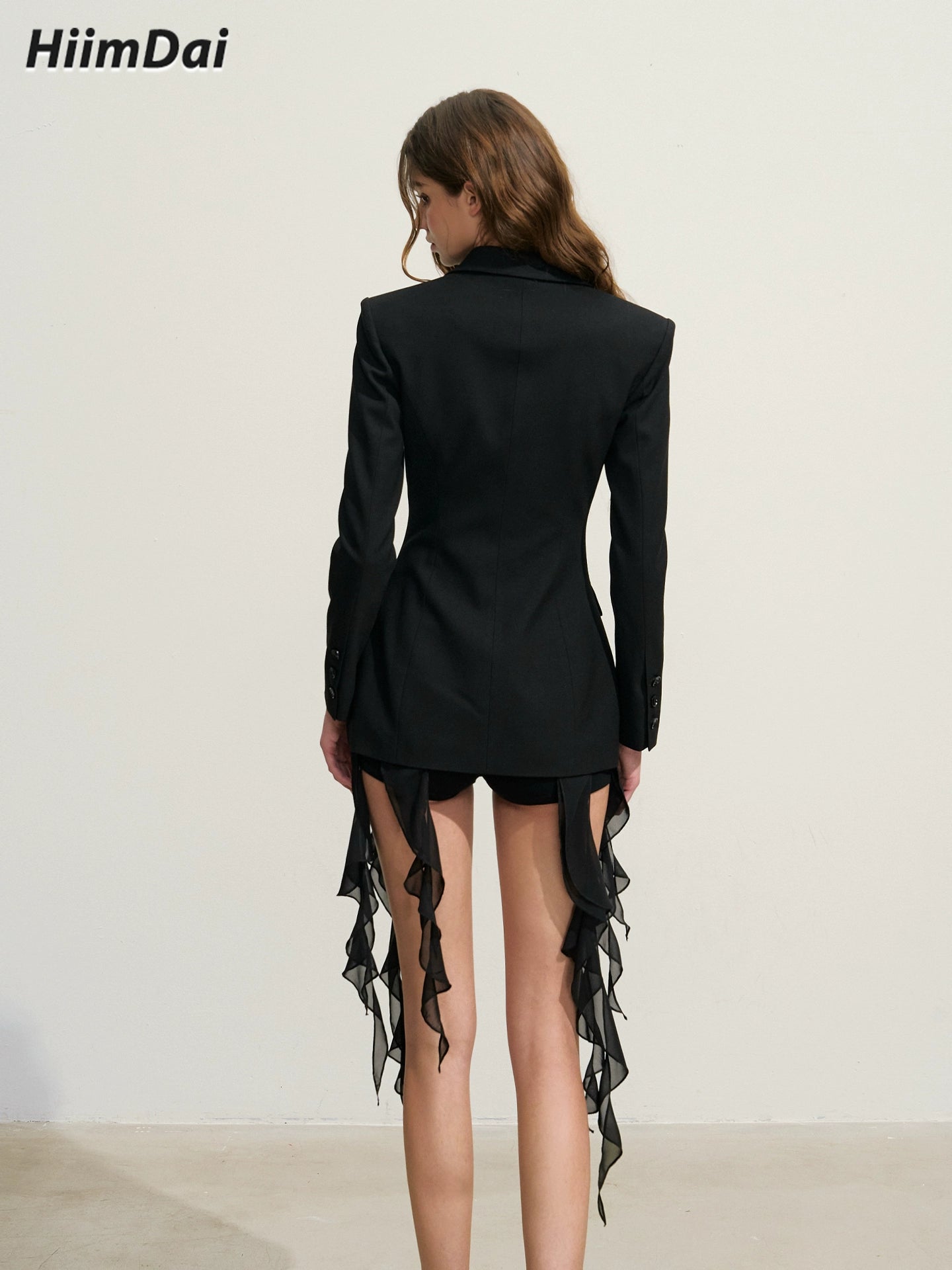 Layered black suit jacket with fungus edge