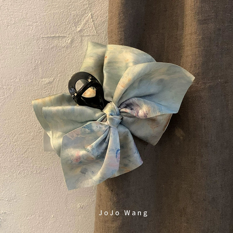 Satin bow hair catcher