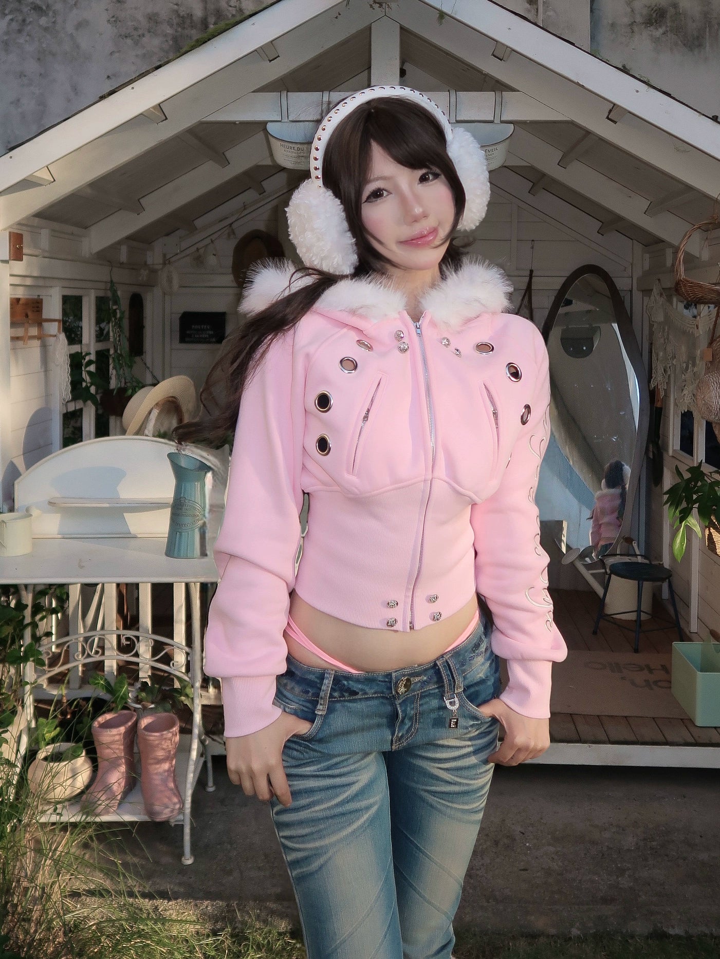 furry hooded sweatshirt and a black embroidered jacket